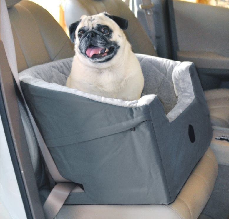 K&H Bucket Booster dog car seat in grey and cream, seat belt secured with two safety leashes