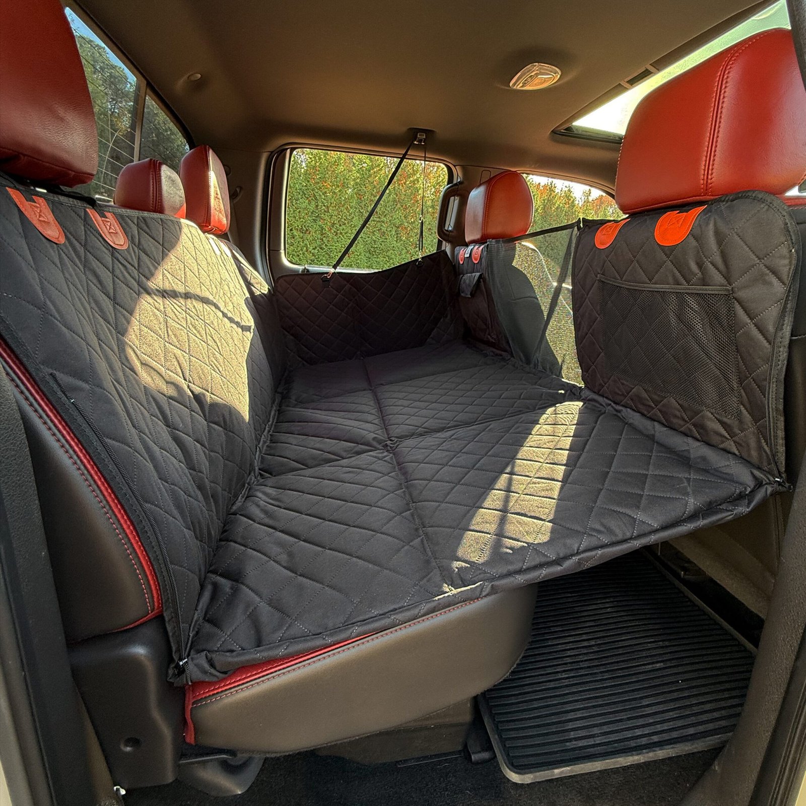 BarkBridge+ Backseat Extender by Roaming Bone, quilted hard-bottom platform installed in a truck