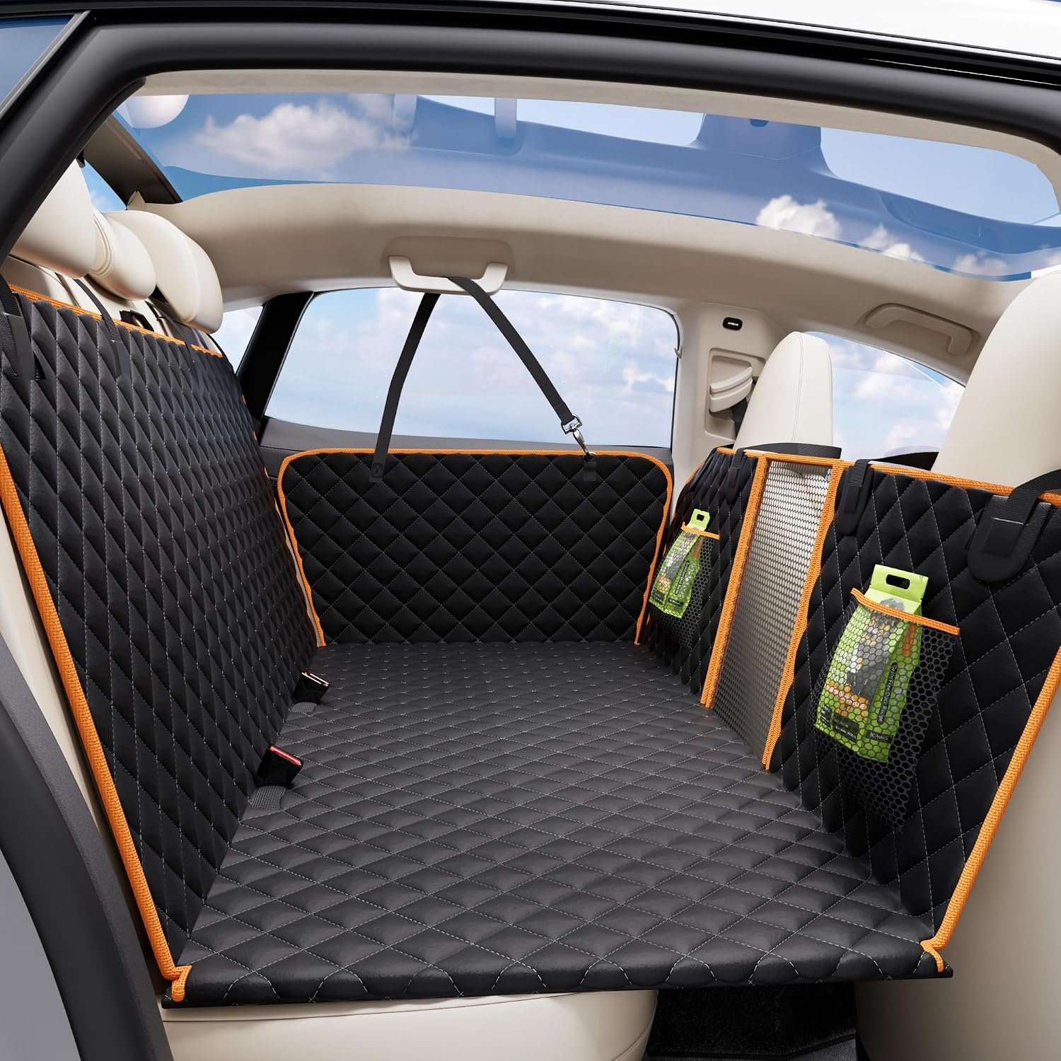 Eamefia black and orange quilted back seat extender with mesh window installed in a car back seat