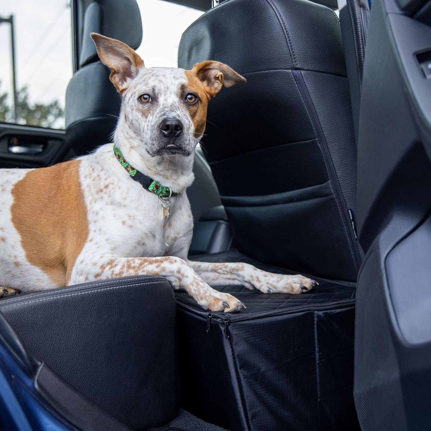 MISTIC COOL dog car seat extender with storage, a box gap filler in a car footwell with a dog's paws resting on it